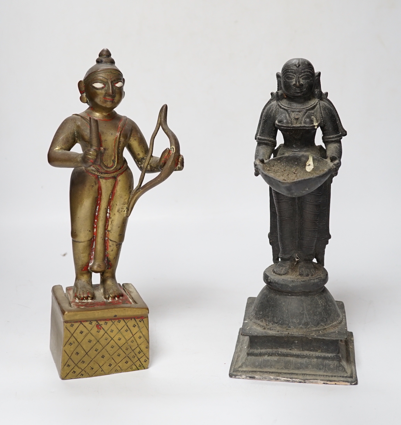 A 19th century Indian ‘Deepalakshni’ butter oil lamp and an 18th century Indian brass figure of Kodanda Rama (quiver of arrows lacking) tallest 26cm